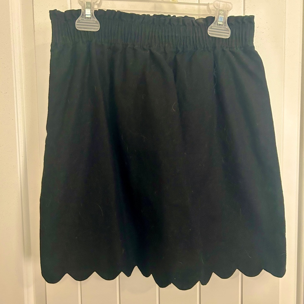 Black J. Crew mini skirt with scalloped edging on bottom